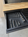 Open drawer of the 72 inch tool cabinet holding a socket set and ratchets on the cushioned drawer liner